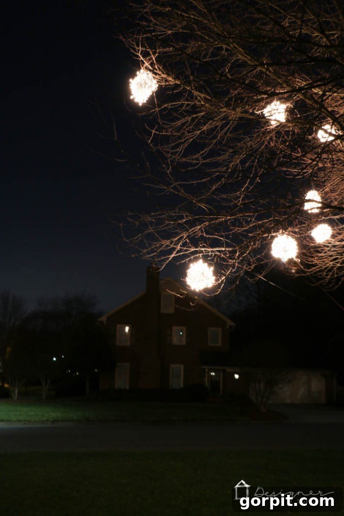 A close-up of a glowing lighted Christmas ball, showcasing the beauty of this DIY outdoor Christmas decoration.