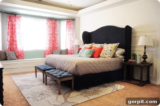 Vibrant navy and coral DIY master bedroom makeover with a stunning custom headboard from All Things Thrifty, showcasing budget-friendly style.