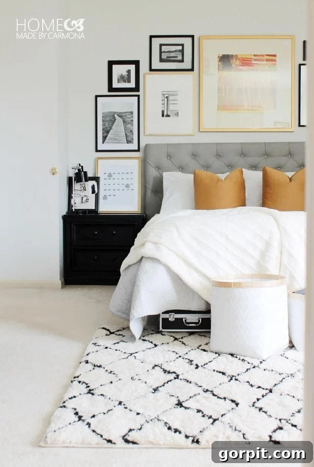 Classy, modern master bedroom makeover by Homemade by Carmona, showcasing an incredible DIY tufted headboard and budget-friendly high-end style.