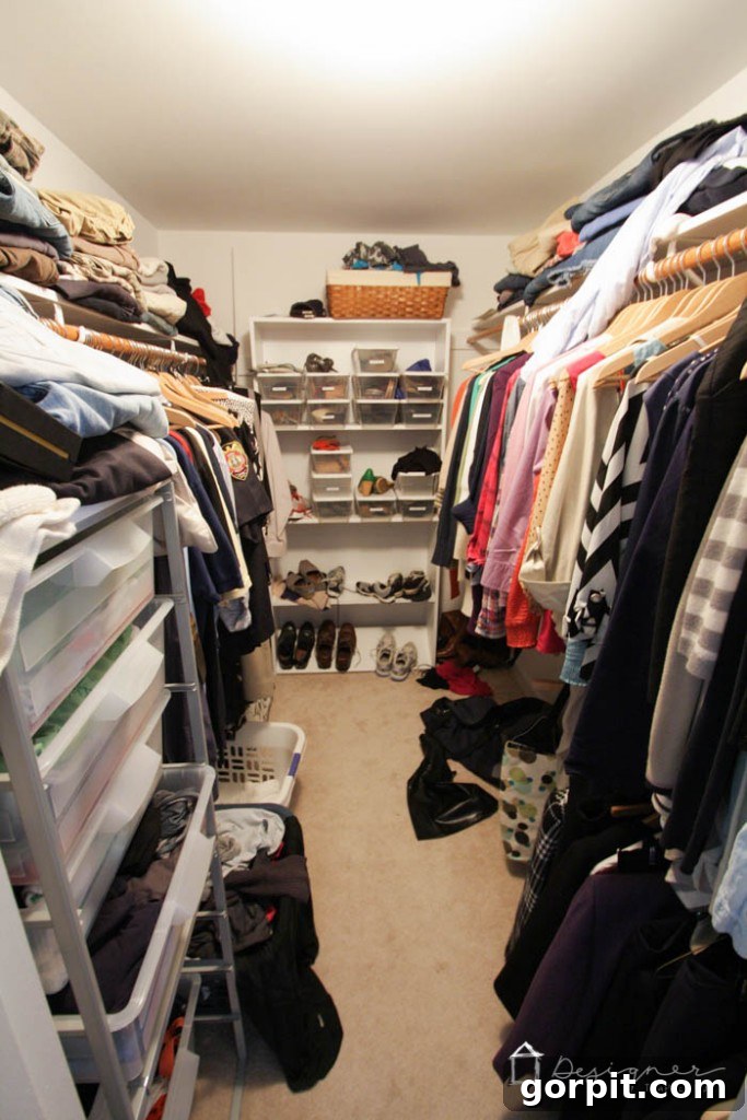 A cluttered closet before organization, filled with various clothes and items, showcasing the need for a system. 