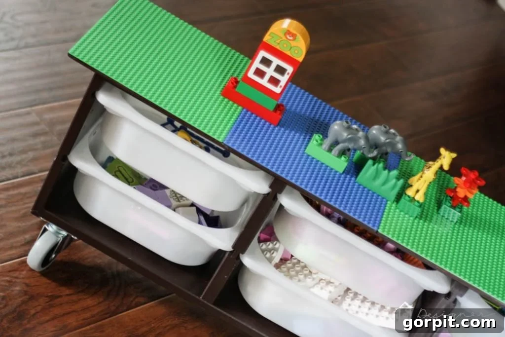 Another perspective of a child playing with Legos on the DIY table, showing the ease of access to the building surface.
