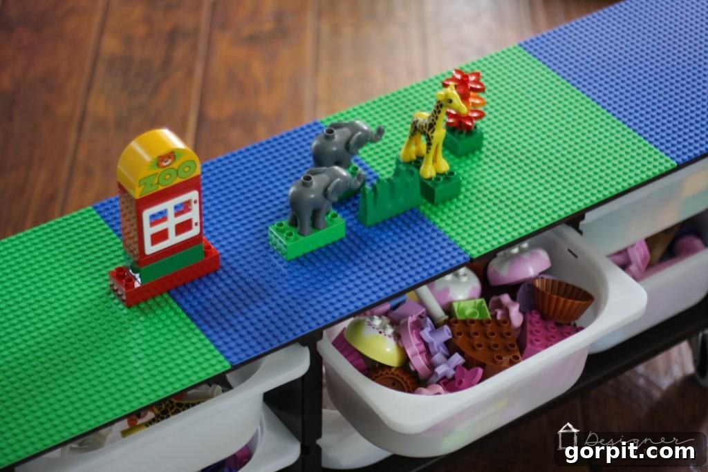 A child actively playing with Lego bricks on the new DIY Lego table, demonstrating its use and the joy it brings.