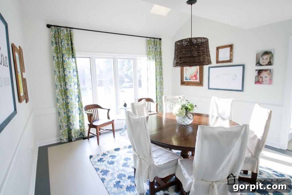 Stunning dining room featuring a robust DIY industrial pipe curtain rod, showcasing its modern aesthetic and durability.