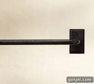 Inspiration image of a sophisticated industrial-style curtain rod, guiding the DIY project design.