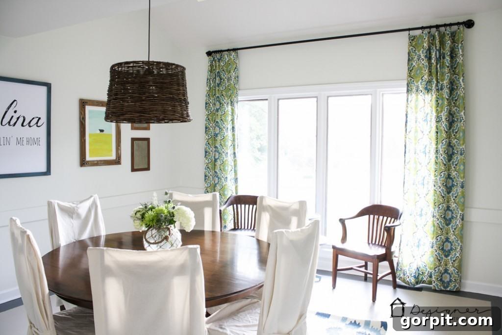 Close-up of the stylish DIY industrial pipe curtain rod with curtains, highlighting the robust construction.