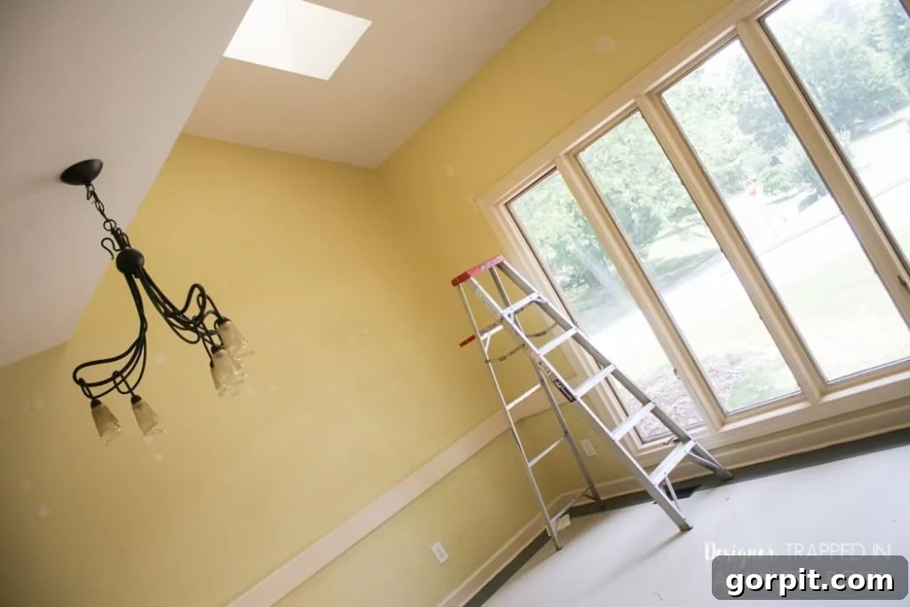 Instant Glow: Beginner-Friendly DIY Lighting 3 Before image of an outdated light fixture in a dining room, ready to be replaced by a modern DIY pendant light.