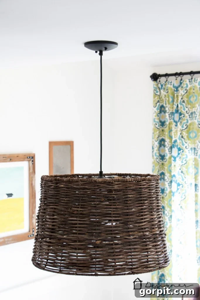 Instant Glow: Beginner-Friendly DIY Lighting 8 Beautifully finished DIY pendant light hanging in a dining room, showcasing its custom design and elegant style.