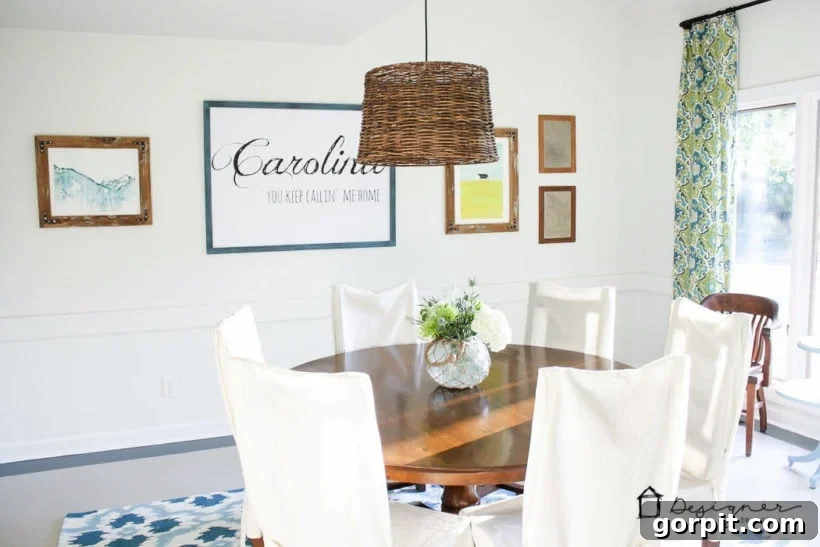 Dining room gallery wall featuring DIY reclaimed wood frames, creating a stylish and personalized space.