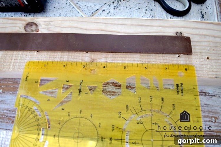 Handcrafting Leather Drawer Pulls for Custom Furniture 3 photo of ruler next to strip of leather to measure for DIY leather drawer pulls