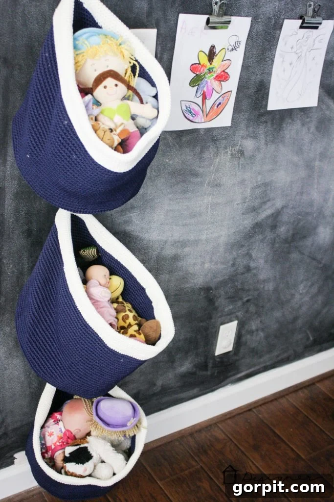 Full view of the kids' playroom showcasing various zones: an activity area, reading nook, and integrated storage, all part of a cohesive playroom decor scheme.