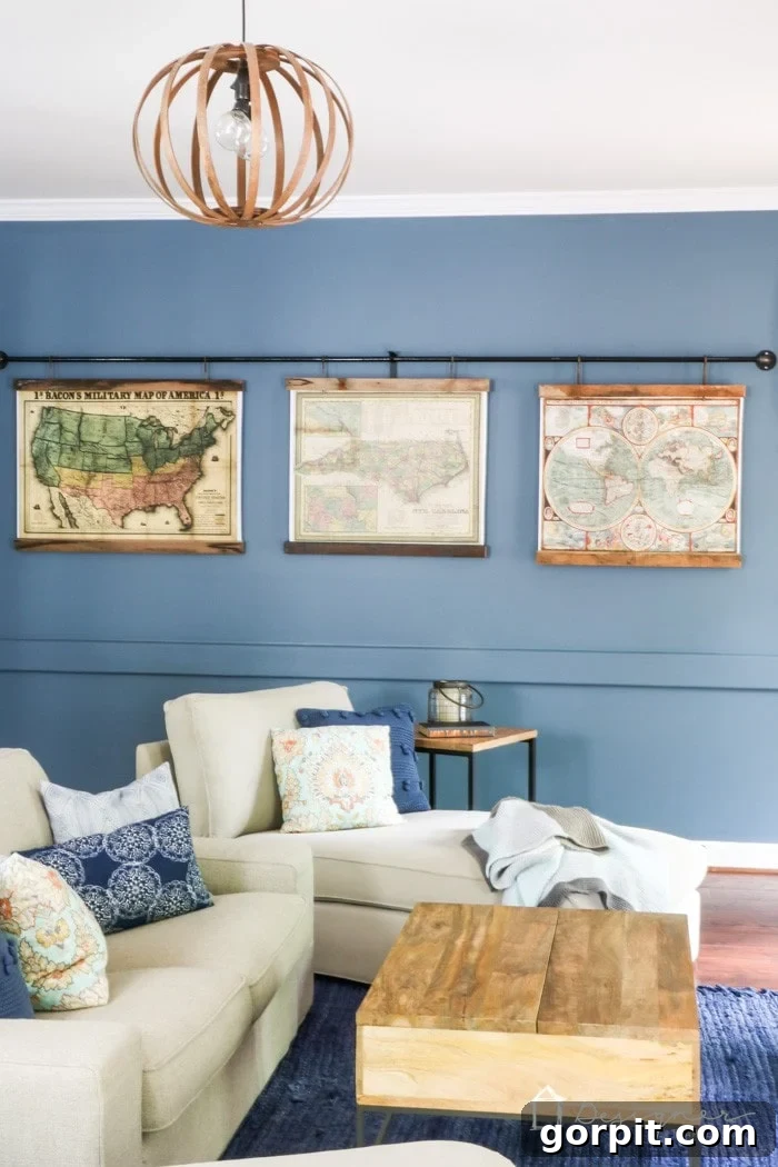 Close-up of a DIY reclaimed wood map frame, highlighting the textured wood grain, the vintage map, and the industrial screw hook detail for hanging.