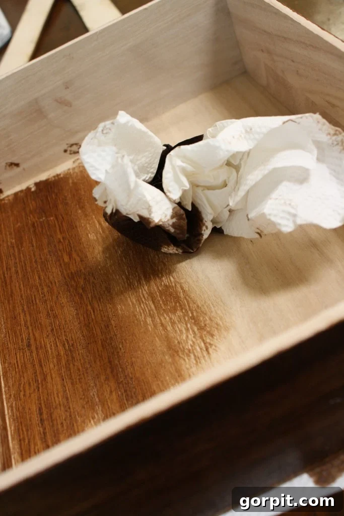 Stained wooden box, ready for typography, as part of the DIY desk organizer project