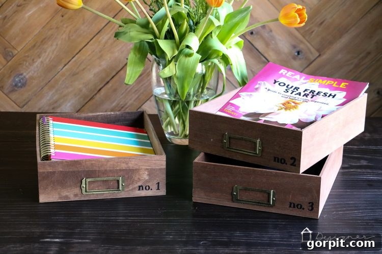 Finished DIY desk organizer trays neatly stacked on a desk, showcasing their functionality and style