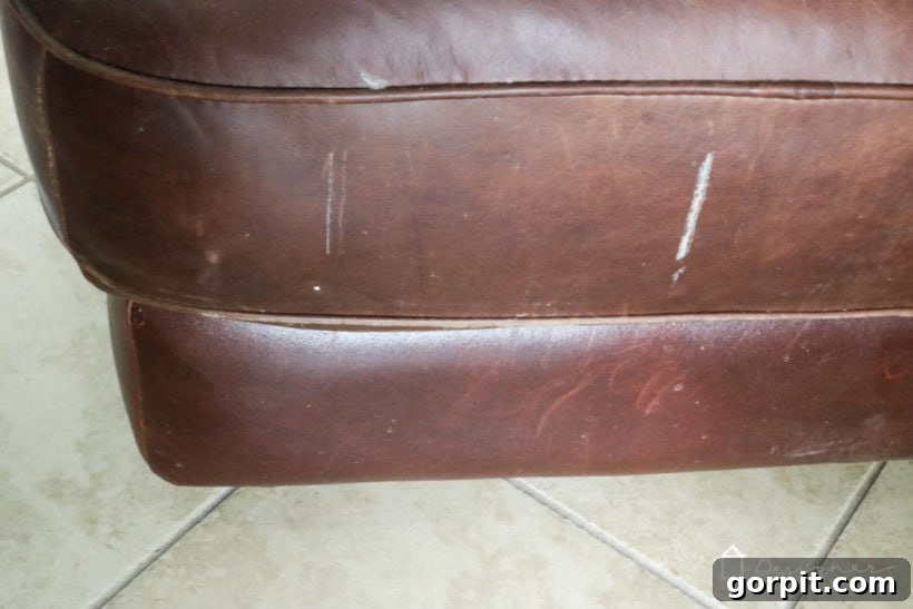 Breathe New Life into Your Leather Furniture 4 close up of damaged leather furniture surface with unknown marks