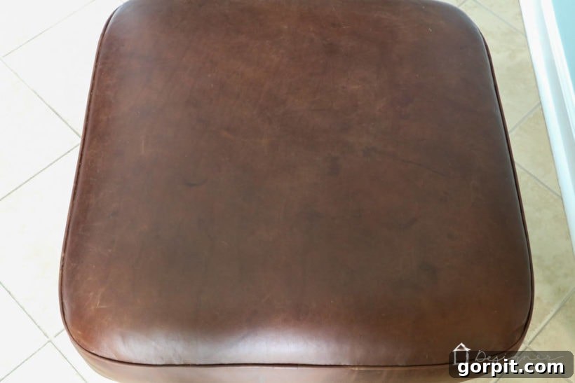 Breathe New Life into Your Leather Furniture 6 Restored leather ottoman after easy DIY repair, looking brand new