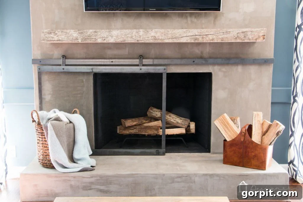 Close-up of the smooth sliding mechanism of the barn door fireplace screen.