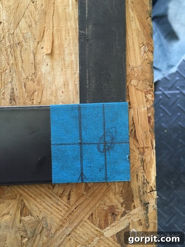 Laying out the steel frame components for precise marking and drilling of the fireplace screen.