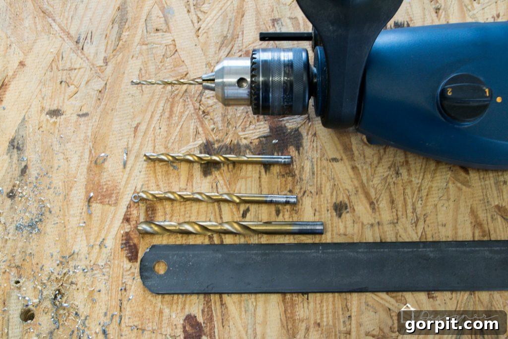 Using a gradual drilling technique to create precise bolt holes in the steel frame.