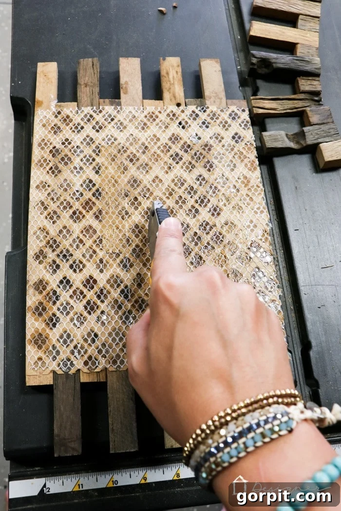 IKEA Lack Transformation: Designer Style for Less 8 Wood mosaic tile sheets dry-fitted across the bottom shelf of the IKEA Lack table, demonstrating the precise placement before permanent adhesion.