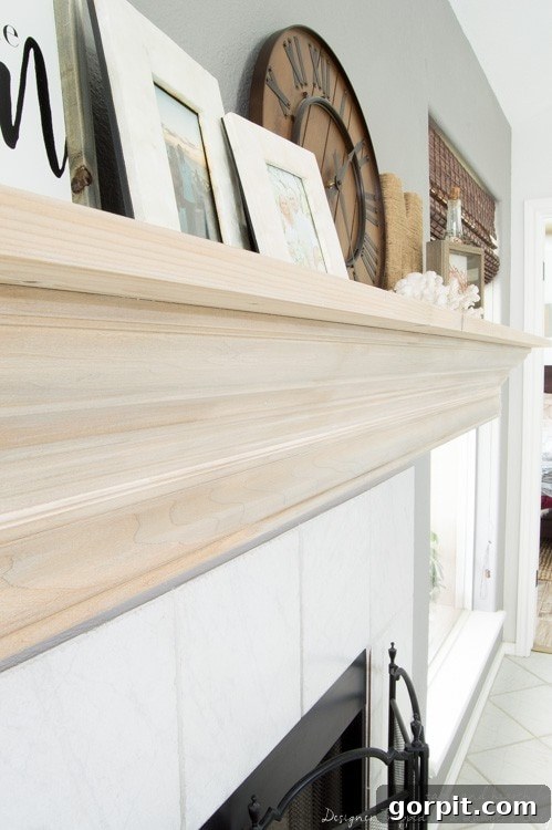 Wow! Check out this DIY fireplace mantel update made from simple molding. Love the driftwood finish! 