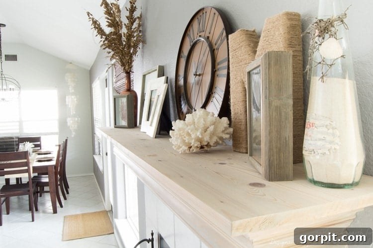 Wow! Check out this DIY fireplace mantel update made from simple molding. Love the driftwood finish! 