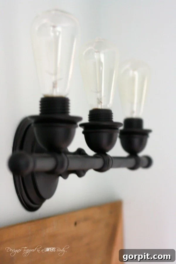 10 Ingenious DIY Light Fixtures on a Budget 3 Upcycled industrial light fixture made from an old vanity light
