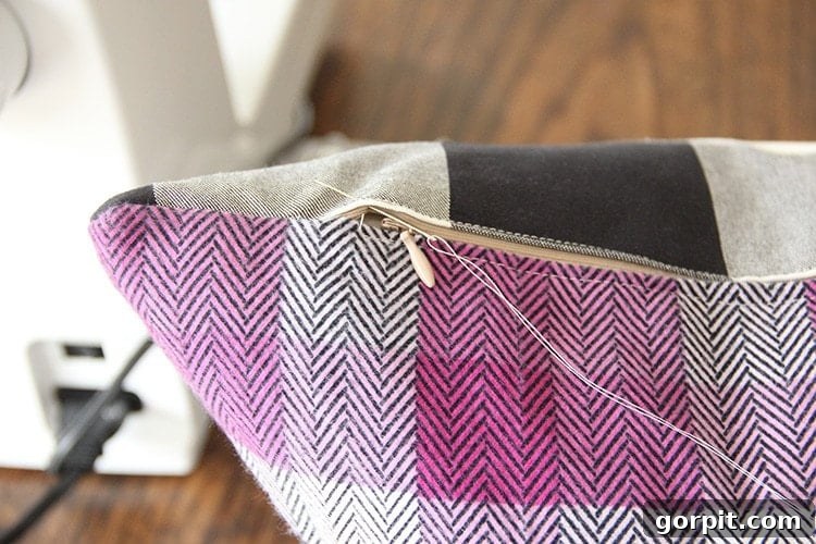 Sew Your Own Zippered Pillow Cover 14 Close-up of a completed zippered pillow cover, showcasing the professional finish and the subtle hand stitching at the zipper ends.