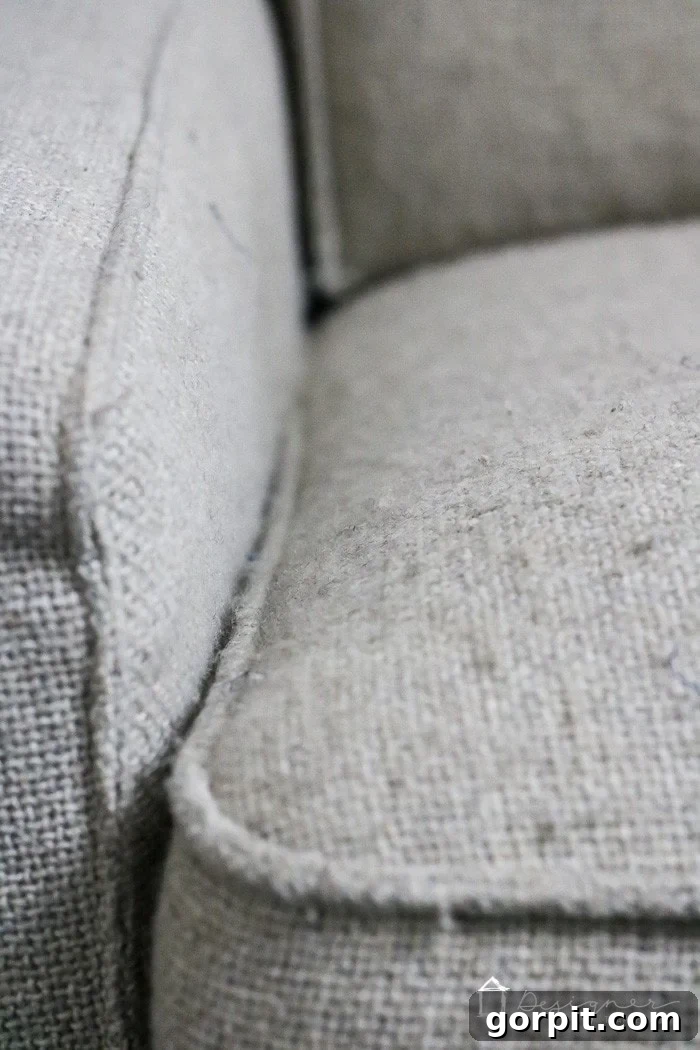 Sofa Makeover: Renew and Protect for Long-Term Style 6 Full 'before' view of an entire couch showing significant fabric pilling and general wear.