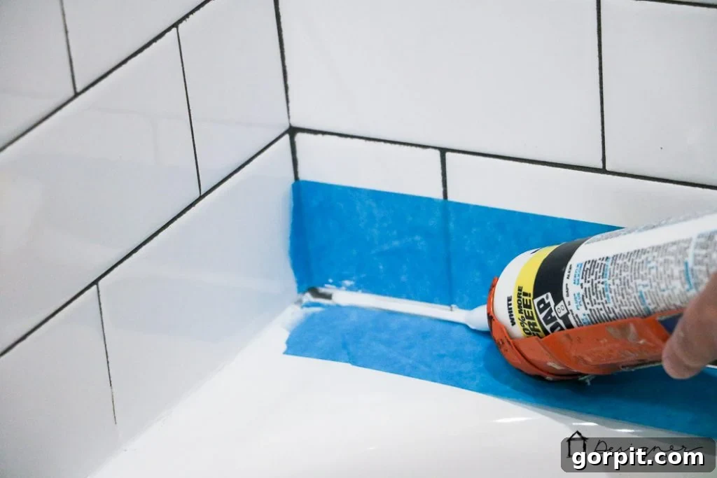 Apply caulk to your bathtub with a steady hand and consistent pressure for a smooth, even bead. Follow these tips for a professional finish on your DIY bathroom project.