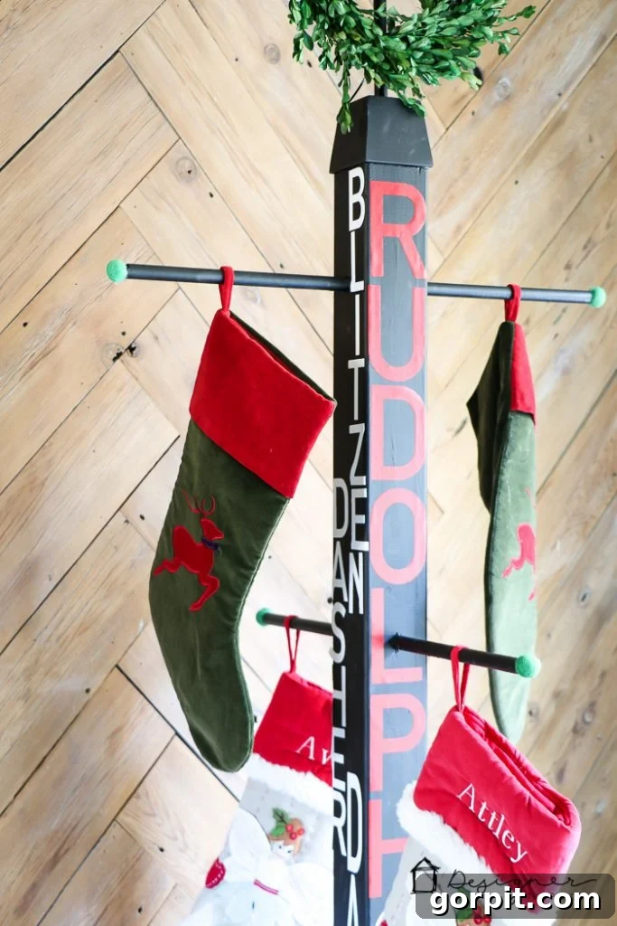 Close-up of Christmas stockings hung on the DIY stand, showcasing personalized details