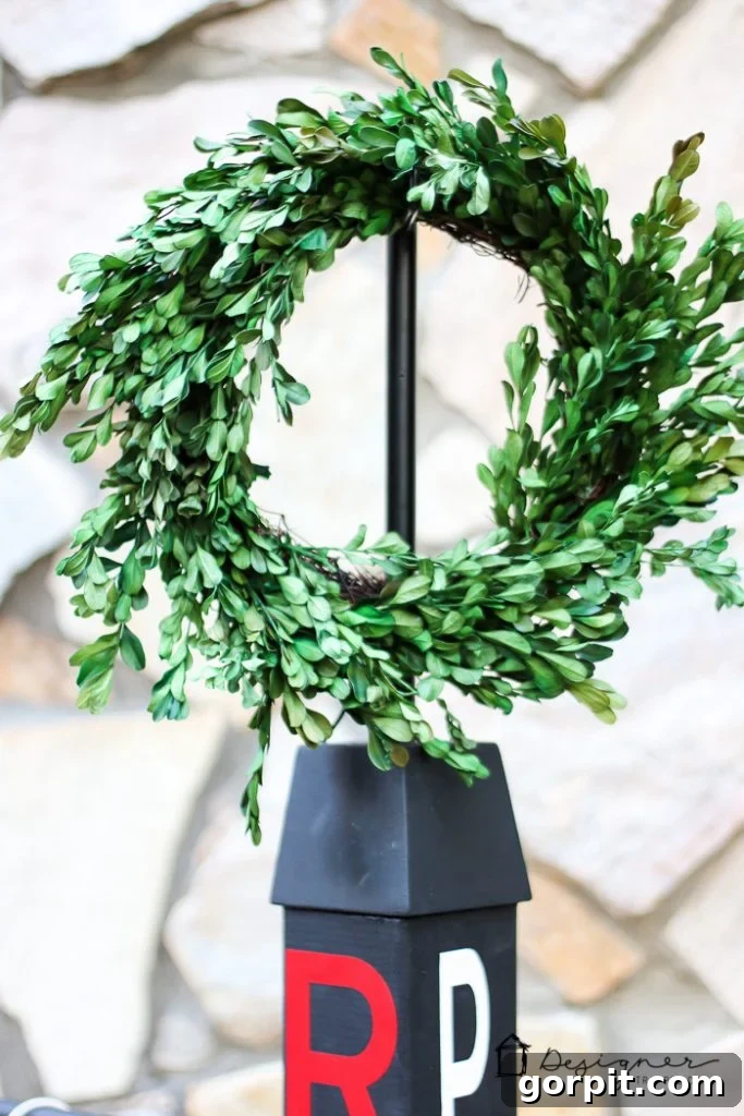 Close-up of lanterns hanging on the versatile DIY outdoor stand