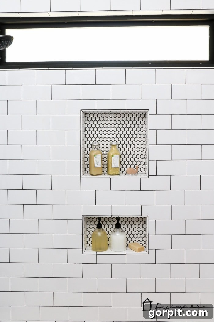 Shower niche with striking penny tile accent and a newly installed black-framed window.