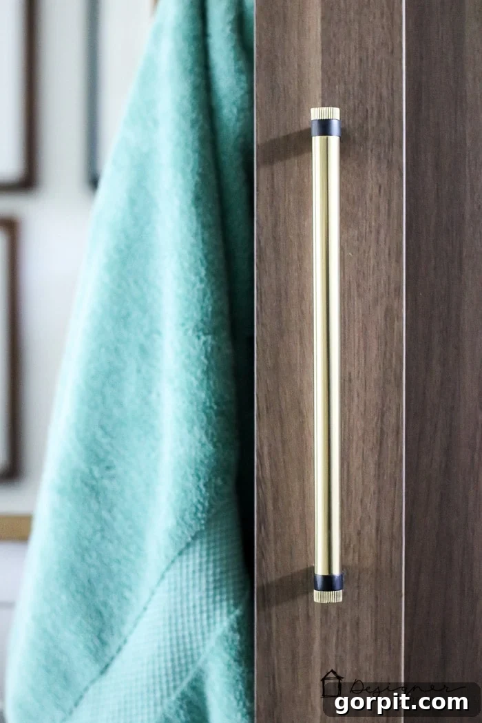 Close-up of elegant and modern cabinet and drawer hardware in a newly renovated bathroom.
