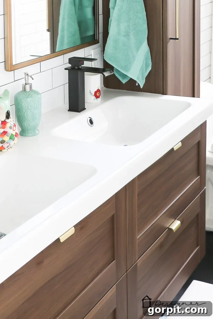 A clean and organized bathroom sink area with contemporary hardware and accessories.