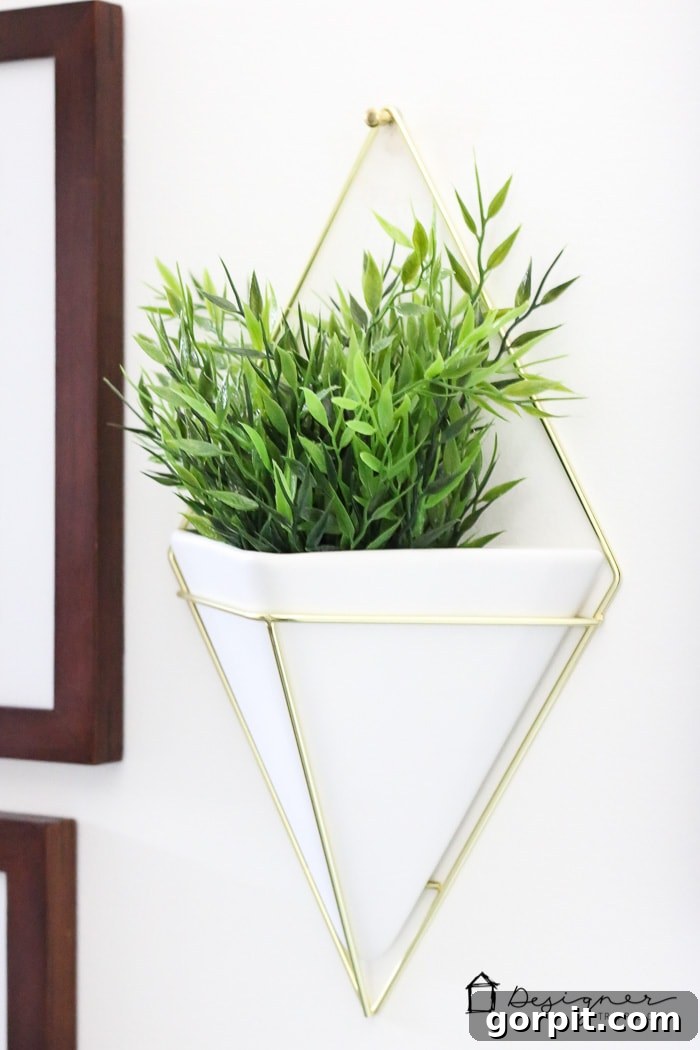 A collection of framed art pieces and decorative elements on a bathroom gallery wall.