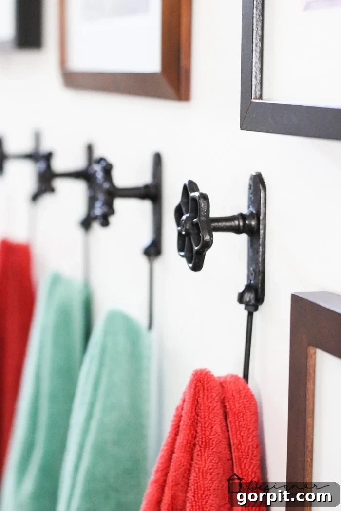 Close-up of unique and charming towel hooks in a renovated family bathroom.