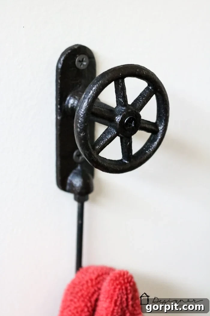 Stylish and practical bathroom decor featuring decorative elements and functional hooks.