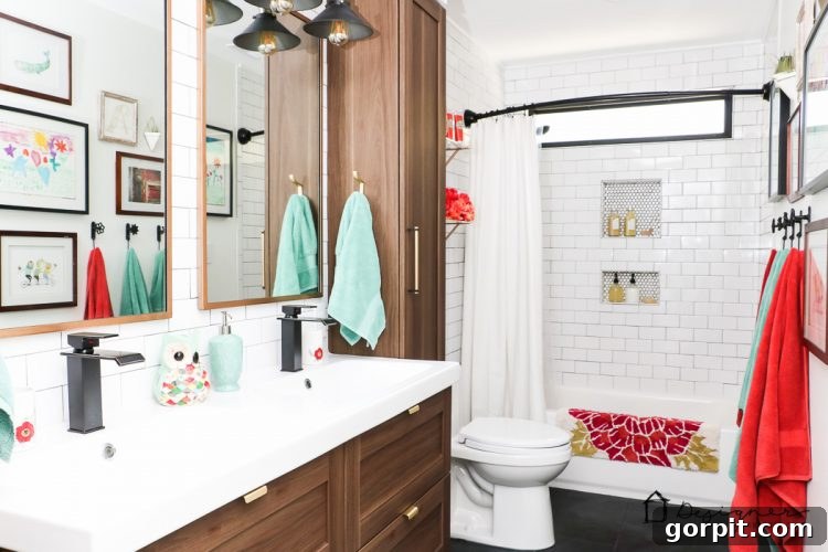 The stunning reveal of a DIY bathroom remodel with modern subway tile, slate floor, and elegant fixtures.