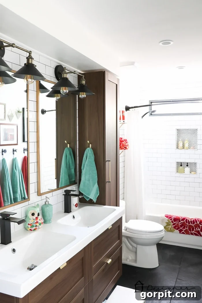Close-up of the elegant floating vanity and modern lighting in a newly renovated DIY bathroom.