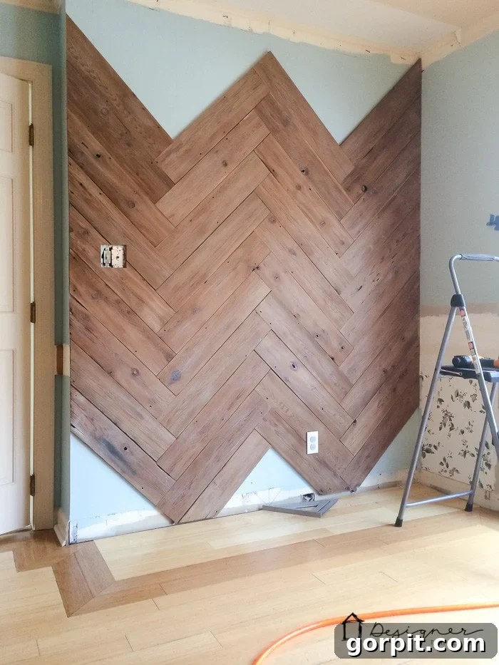 Transforming an Old Fence into a DIY Herringbone Wall 9 in process herringbone wall