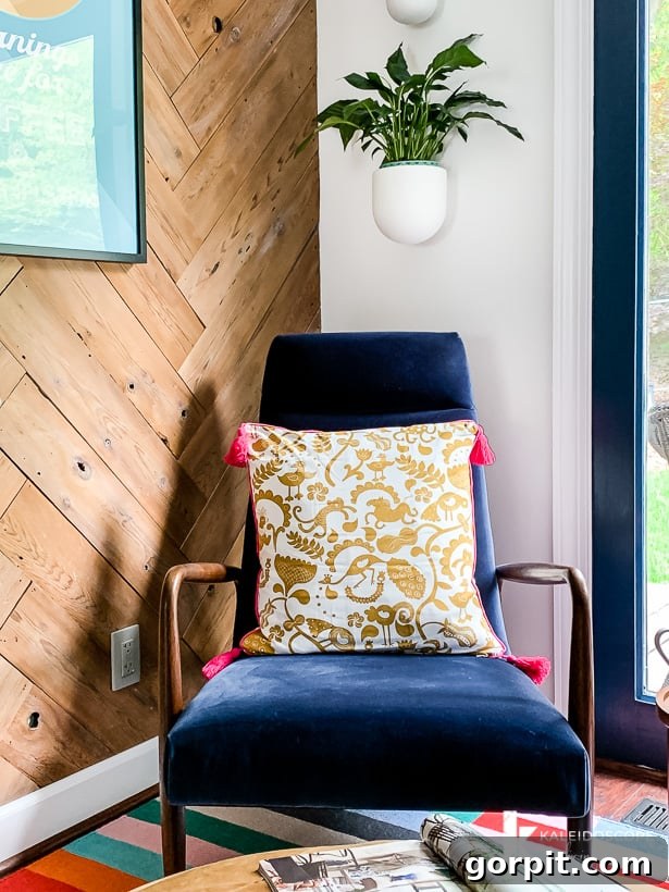 Transforming an Old Fence into a DIY Herringbone Wall 12 diy plank wall in sitting area