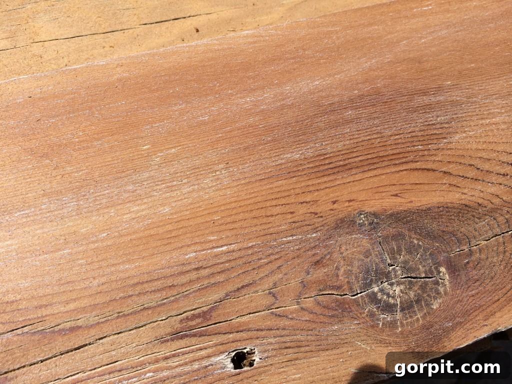 Transforming an Old Fence into a DIY Herringbone Wall 5 finished board