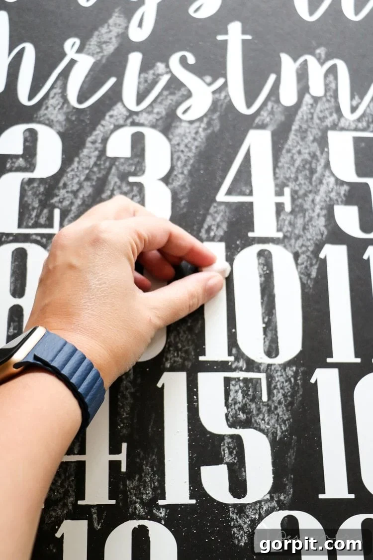 Applying chalk dust to a vinyl sign to create a faux chalkboard look
