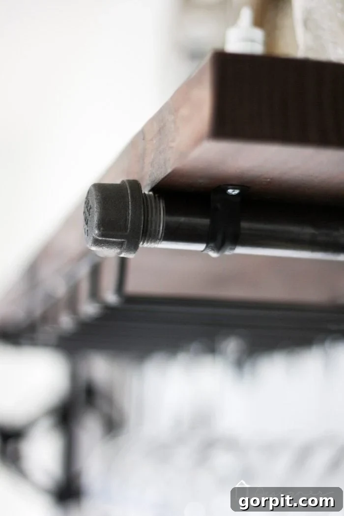 Easy Pipe Shelf Building Guide 6 Finished industrial shelves with wooden boards secured