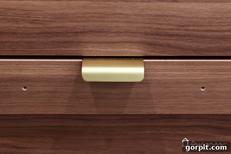 Unlock Ikea Cabinet Potential: Bypass Pre-Drilled Door and Drawer Holes 3 Close-up view of Ikea cabinet door before the hack, showing visible pre-drilled holes.