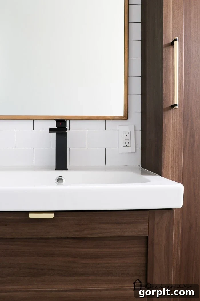 Unlock Ikea Cabinet Potential: Bypass Pre-Drilled Door and Drawer Holes 6 Another perspective of the transformed Ikea bathroom cabinets, highlighting the personalized hardware.