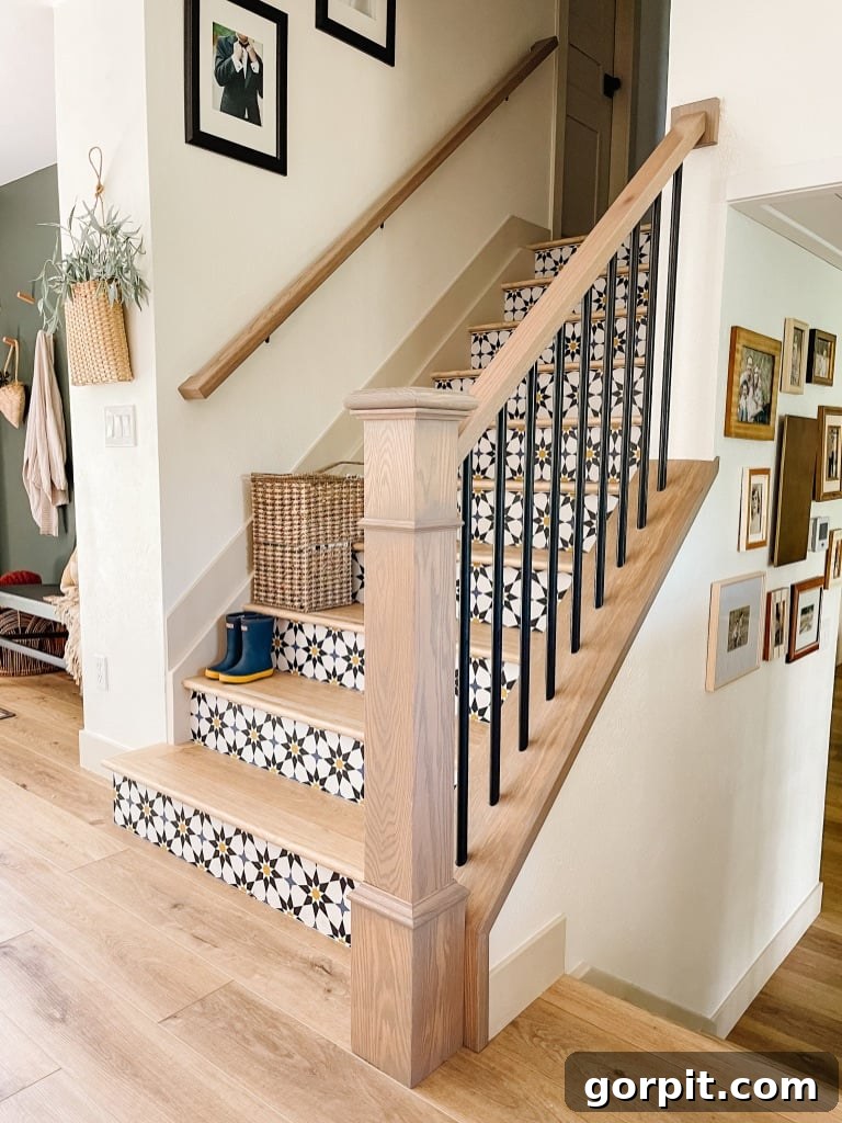 Stairway to Style: Creative Riser Designs 3 Stair risers decorated with graphic peel and stick wallpaper, showcasing a bold pattern that adds significant visual interest.