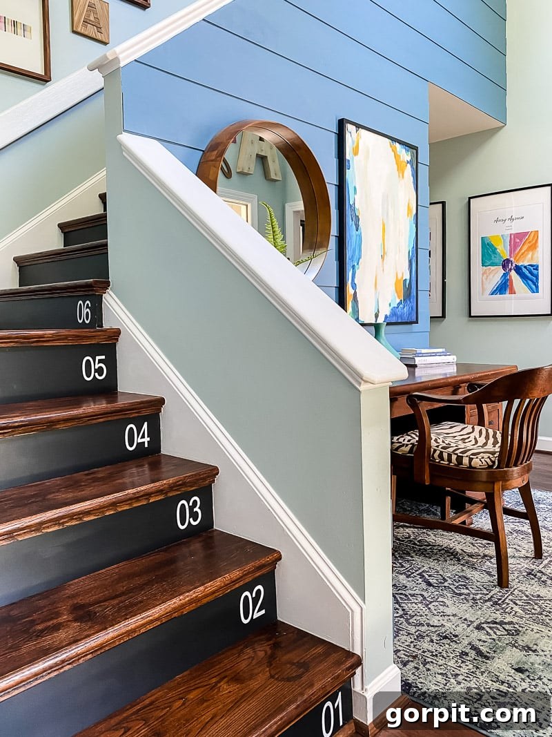 Stairway to Style: Creative Riser Designs 7 Wood stair risers painted black with large white numbers, creating a bold and personalized staircase design.