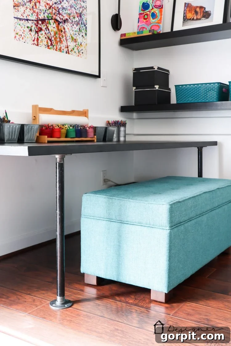 Effortless Pipe Desk DIY 11 Beautifully finished black DIY industrial pipe desk in a child's playroom, ready for use with bright decor.