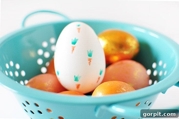 Assorted Easter eggs decorated with vibrant fruit stamps, showcasing a fresh and playful design.